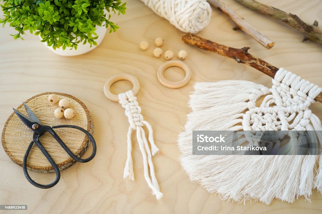 A Handmade Macrame Amulet With Wooden Rings In A Beautiful Background  Setting The Mood For Creativity Stock Photo - Download Image Now - iStock