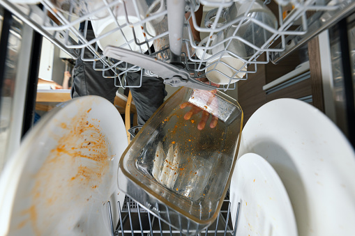 Pile of dirty dishes in domestic kitchen