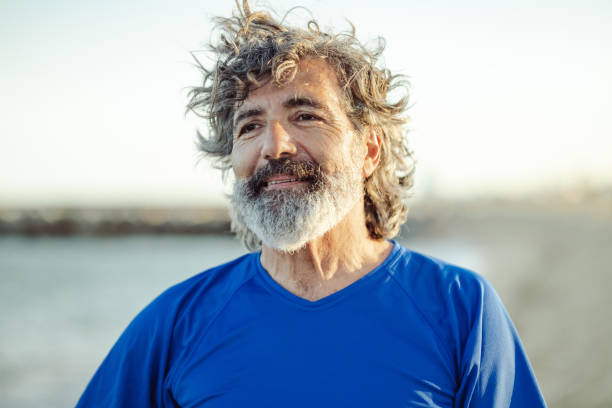 istock Satisfied senior man thinking at beach 1488926717