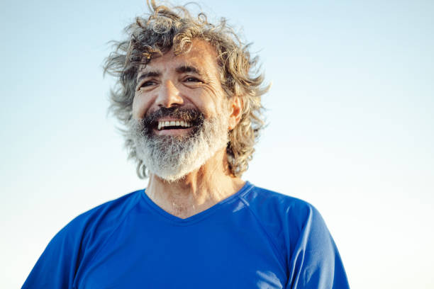 istock Satisfied senior man thinking at beach 1488927045