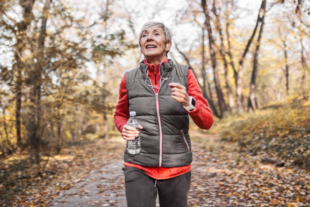 istock Senior woman jogging in park 1488928474