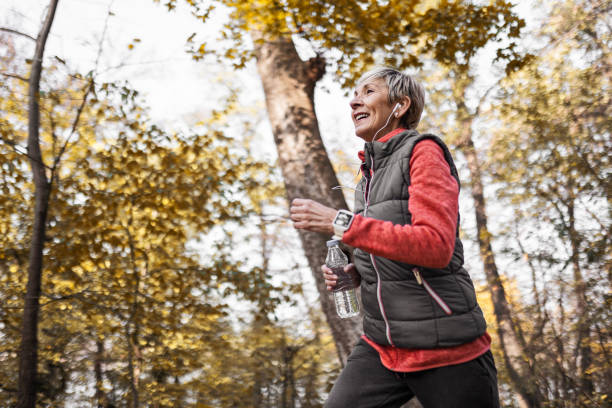 istock Senior woman jogging in park 1488928479