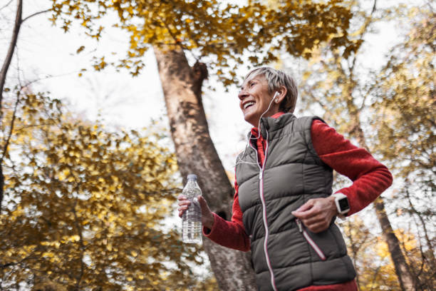 istock Senior woman jogging in park 1488928507