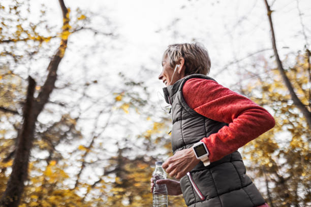 istock Senior woman jogging in park 1488928536