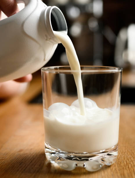 istock Girl with milk at kitchen at home 1488929413