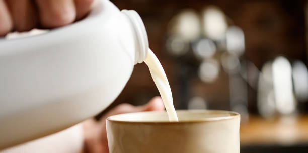 istock Girl with milk at kitchen at home 1488929458