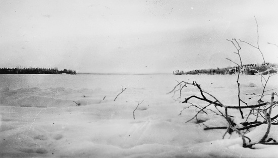 The snowy landscape of Cold Lake in Manitoba, Canada. Vintage photograph ca. 1928.