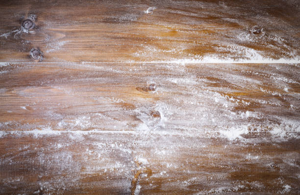 istock Pastry board with flour. Wooden background, space for text. 1488939110