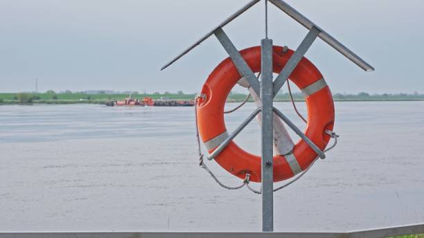 istock Lifebuoy Ring Hanging at River Dart Cable Ferry Port 1488942854