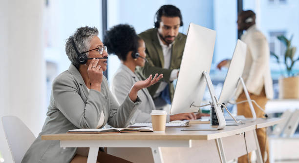 istock Call center, office team and people with telemarketing communication, customer support and telecom startup. Talking, computer chat and business woman, employees or agent at consulting agency company 1488948981