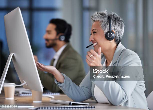 Senior Woman Call Center And Consulting In Telemarketing Customer Service Or Support At Office Desk Happy Elderly Female Consultant Smile With Headset For Marketing Help Or Consultation Advice Stock Photo - Download Image Now