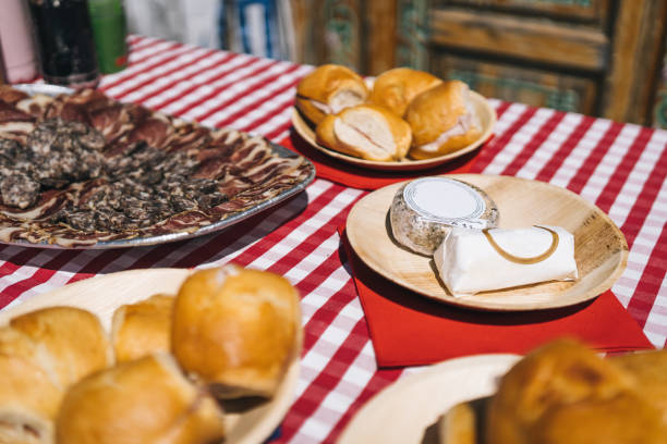 istock Meat and cheese plates on a chequered picnic table cloth 1488952094