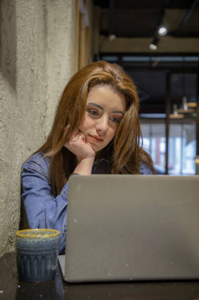 istock Woman working with her computer in cafe 1488953240