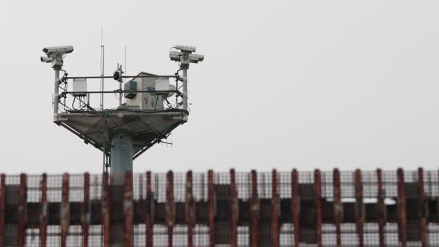 Close-Up View of a Tall Security Camera Tower Watching for Immigrants Crossing at the Tijuana - San Diego / Mexico - United States Border in Tijuana Mexico