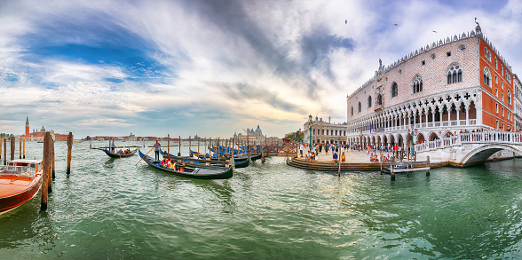 Captivating  landscape with Church of San Giorgio Maggiore on background and gondolas parked beside the Riva degli Schiavoni in Venice. Location: Venice, Veneto region, Italy, Europe