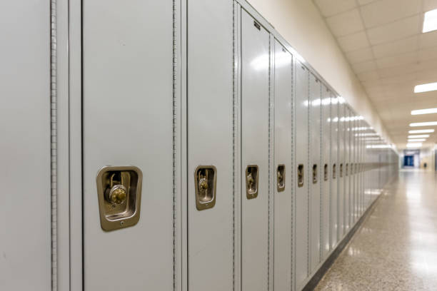 istock Empty middle school or high school hallway with gray student lockers 1488960773