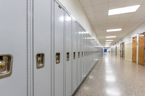 istock Empty middle school or high school hallway with gray student lockers 1488960776