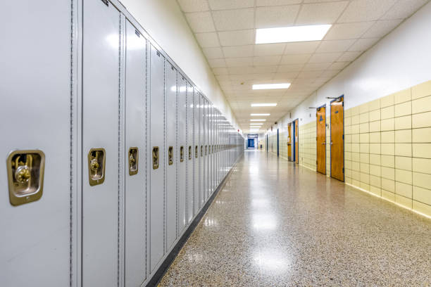 istock Empty middle school or high school hallway with gray student lockers 1488960777