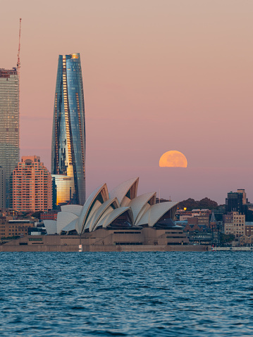 Sydney, Australia - May 6, 2023: Moonset view over Sydney Harbour.