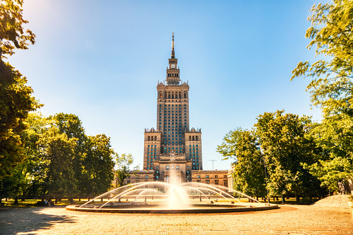 Palace of Culture and Science with Fountain during a Sunny Day in Warsaw, Poland