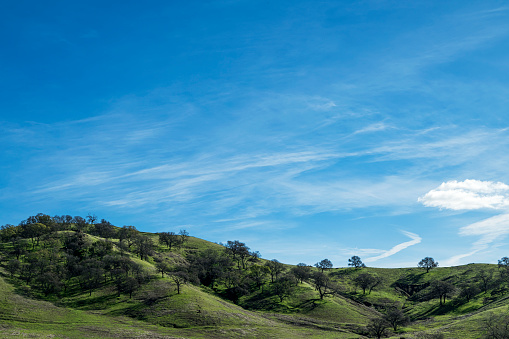 Wide springtime view of California Coastal Foothills, with clouds in the background\n\nTaken near Vacaville, California, USA