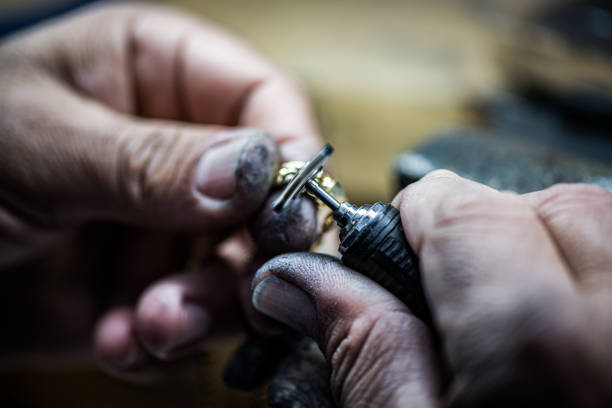 istock Crafting Elegance: A Skilled Hand Creating a Beautiful Jewel 1488962930