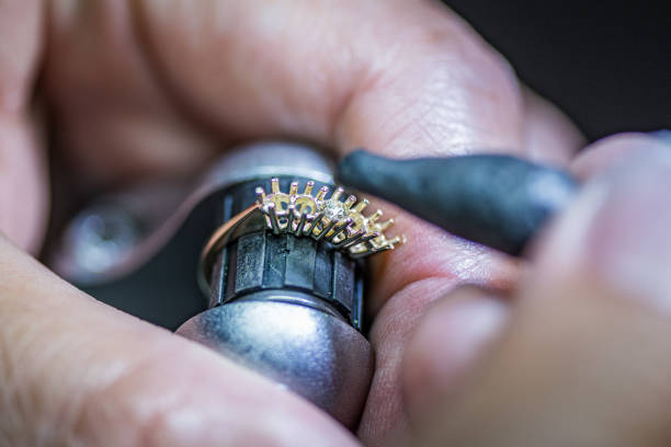 istock Crafting Elegance: A Skilled Hand Creating a Beautiful Jewel 1488962966