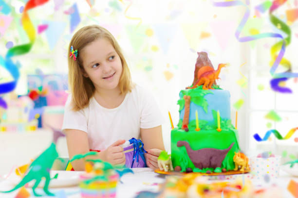 istock Kids birthday party. Dinosaur theme cake. 1488963880