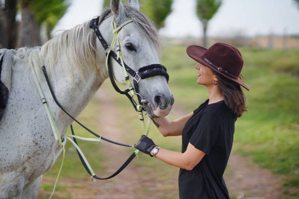 istock Woman and her horse 1488964259