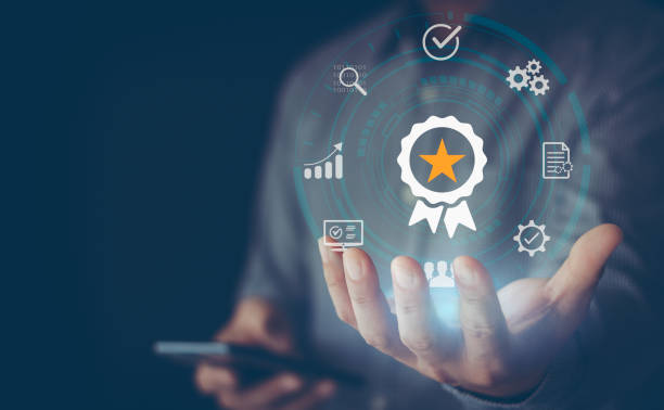 istock Standard quality assurance control certification business technology concept on virtual screen. Hand showing symbol quality assurance and standard, concept ISO certification of excellent service. 1488965625
