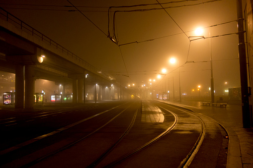 Tram tracks at cloudy night in Amsterdam