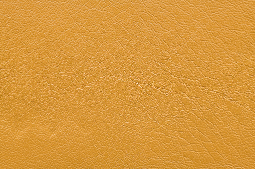 Yellow imitation Artificial leather texture background. Abstract