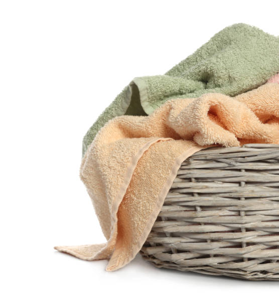 istock Towels in wicker basket on white background 1488977135