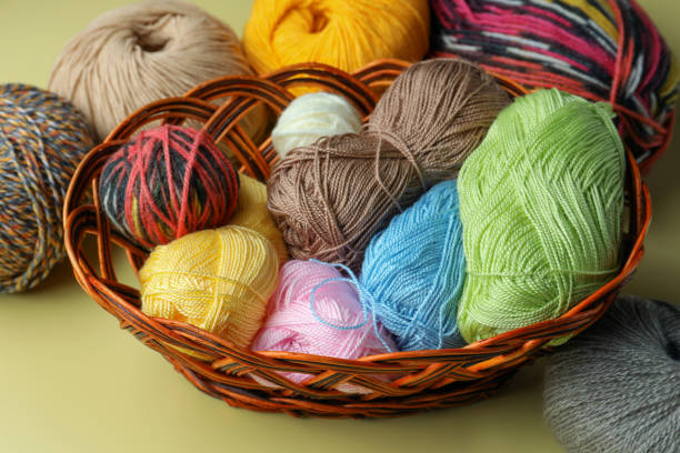 istock Many different soft woolen yarns on yellow background 1488978552