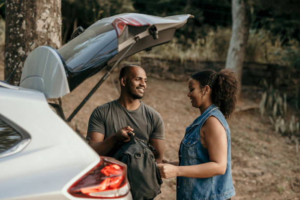 istock Couple taking trail backpacks out of car 1488979667