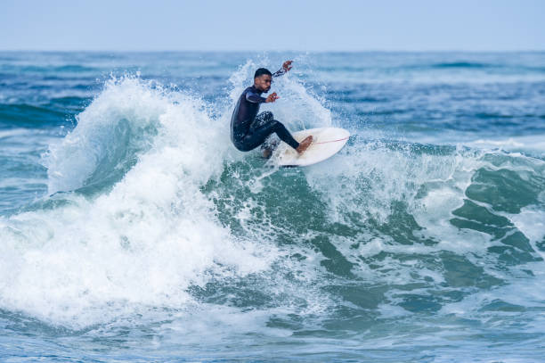 istock Surfer riding waves in Furadouro Beach 1488981070