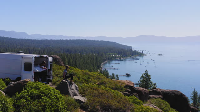 Young Couple Parked Van at a Viewpoint of Lake Tahoe
