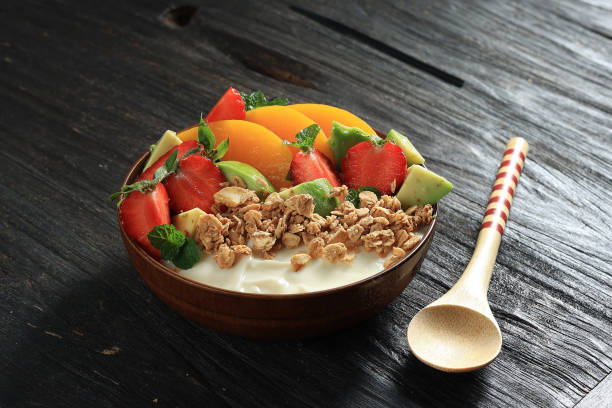 istock Greek Yoghurt in a Bowl with Fresh Fruit and Granola 1488989361