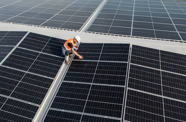 istock Man working on the installation of solar panels system. 1488990881