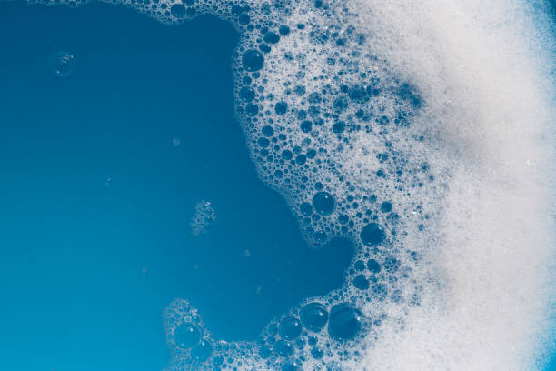 istock Detergent foam bubble on wate. Blue background, Soap sud 1488991805