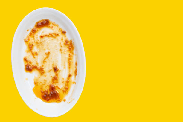 istock Dirty dish on yellow background. Top view 1488991845