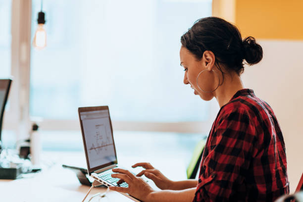 istock A young woman using a laptop to present her business with online clients 1488992502