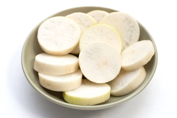 istock Sliced Japanese daikon. Fresh vegetables 1488998571