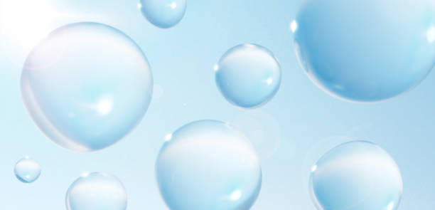 3D Illustration.Multiple round water drops in blue sky. Background with sunlight. Lens flare is available. (Horizontal)