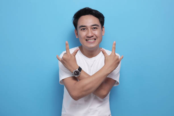 istock Man shows heavy metal gesture sign 1489021068