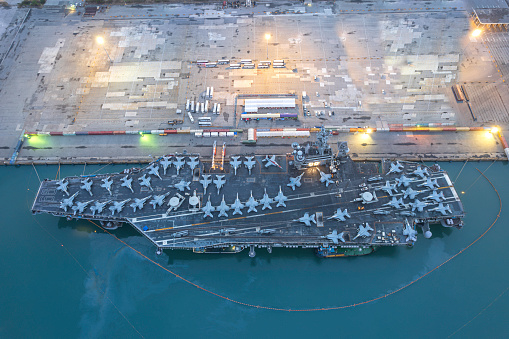 Nuclear War Ship, Military navy ship carrier full loading fighter jet aircraft for prepare troops. forwarder mast. Side view of War Ship.