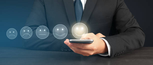 istock Man holding smartphone device and touching screen with five star rating feedback 1489028224