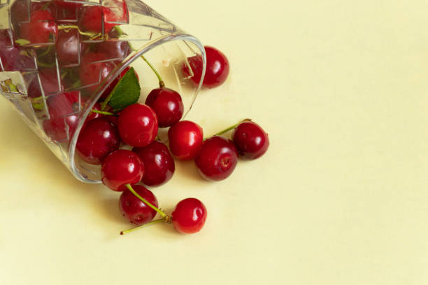 istock ripe cherries in a glass on a red background close-up 1489035738