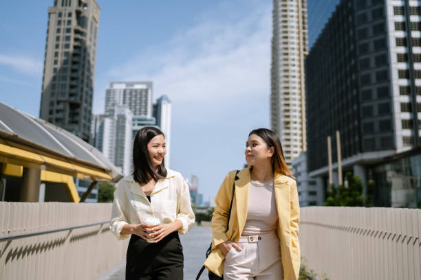 istock Asian Women Enjoying Nice Urban Atmosphere After Work Before Going Home. 1489049899