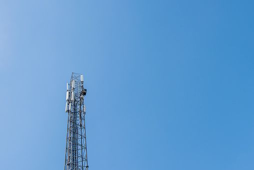 Repeater tower on blue sky background